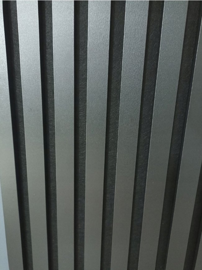 Grey Premium 3D wall slats close-up showing matte finish and profile depth — real installation